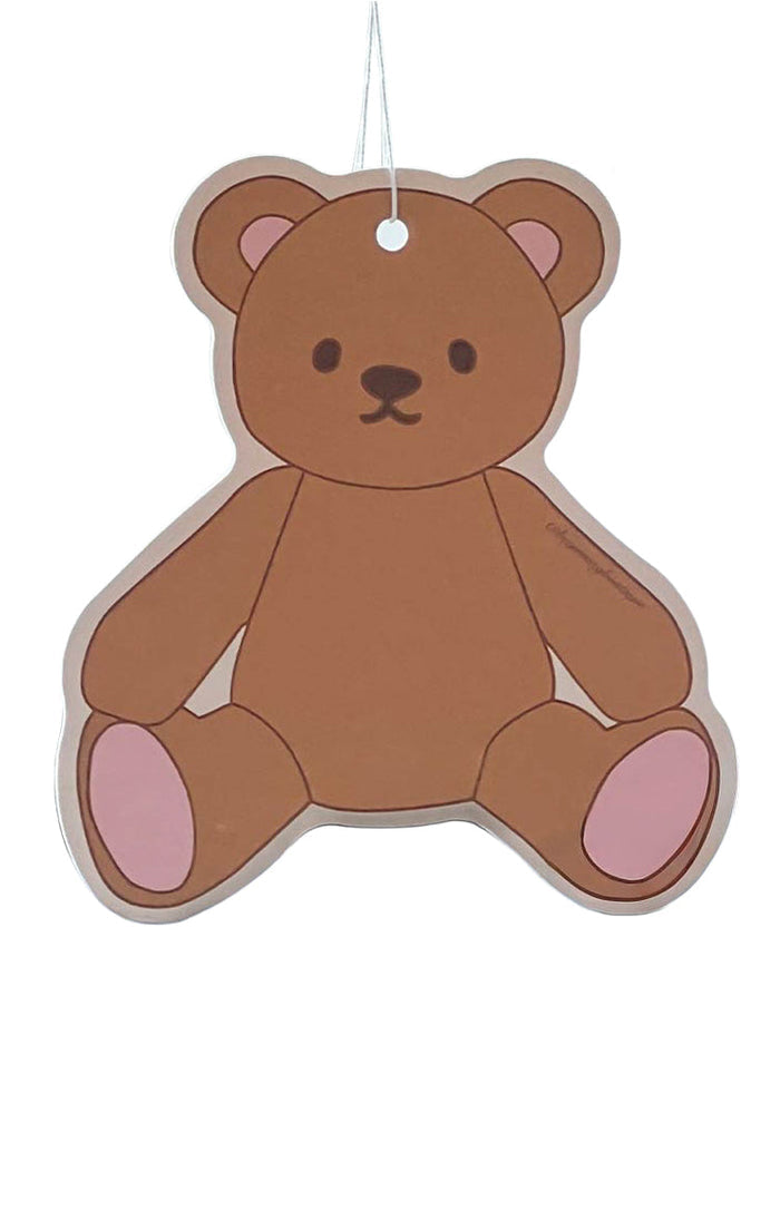 Front view of a brown teddy bear air freshener with pink ear and paw details, black eyes, and a white hanging string