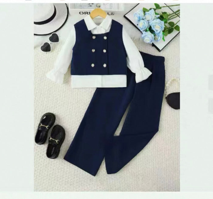 Children's navy vest and pants set with white shirt on a light gray background.