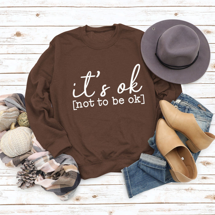 Coffee colored sweater (white font) / S