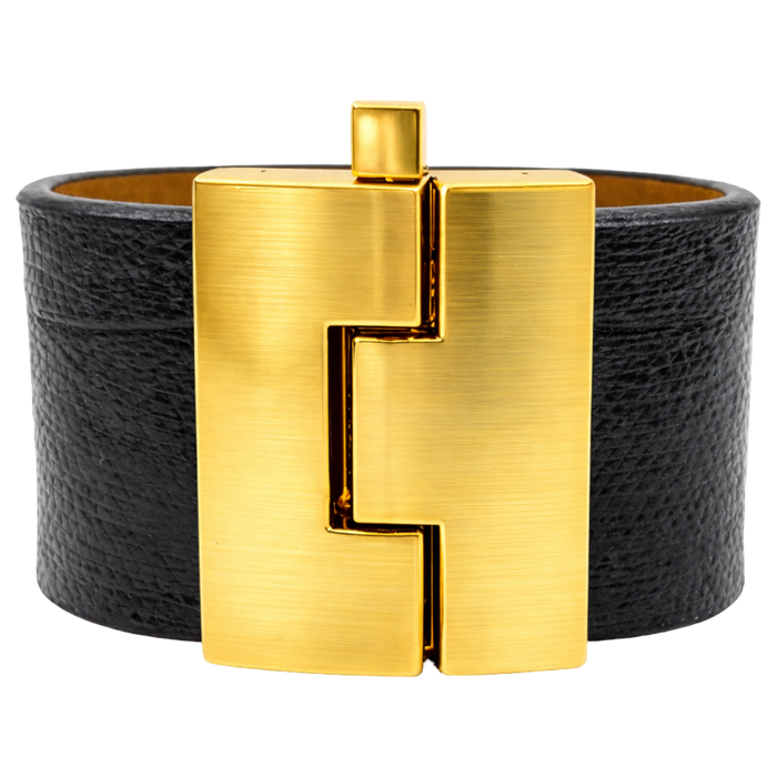 Black leather bracelet with a gold clasp on a white background