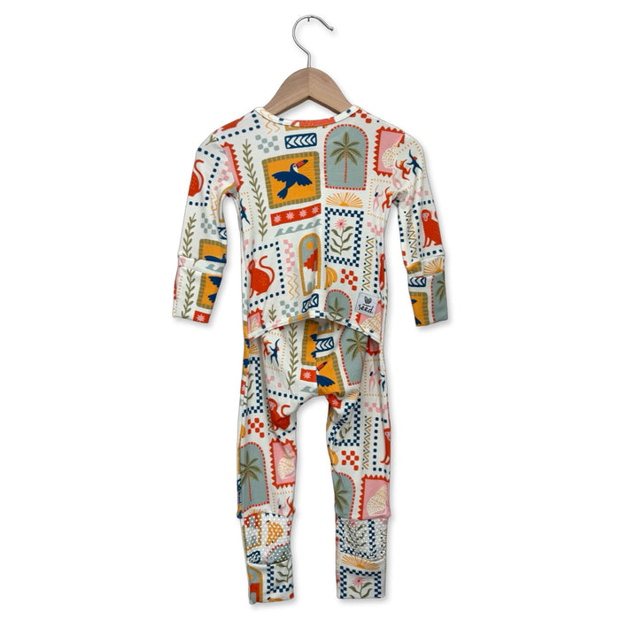 Children's onesie with a colorful pattern on a hanger against a white background