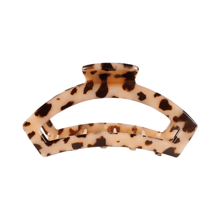 Tortoiseshell patterned hair clip on a white background