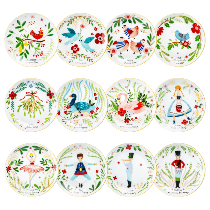 Set of twelve fine porcelain appetizer plates featuring colorful 12 Days of Christmas holiday illustrations