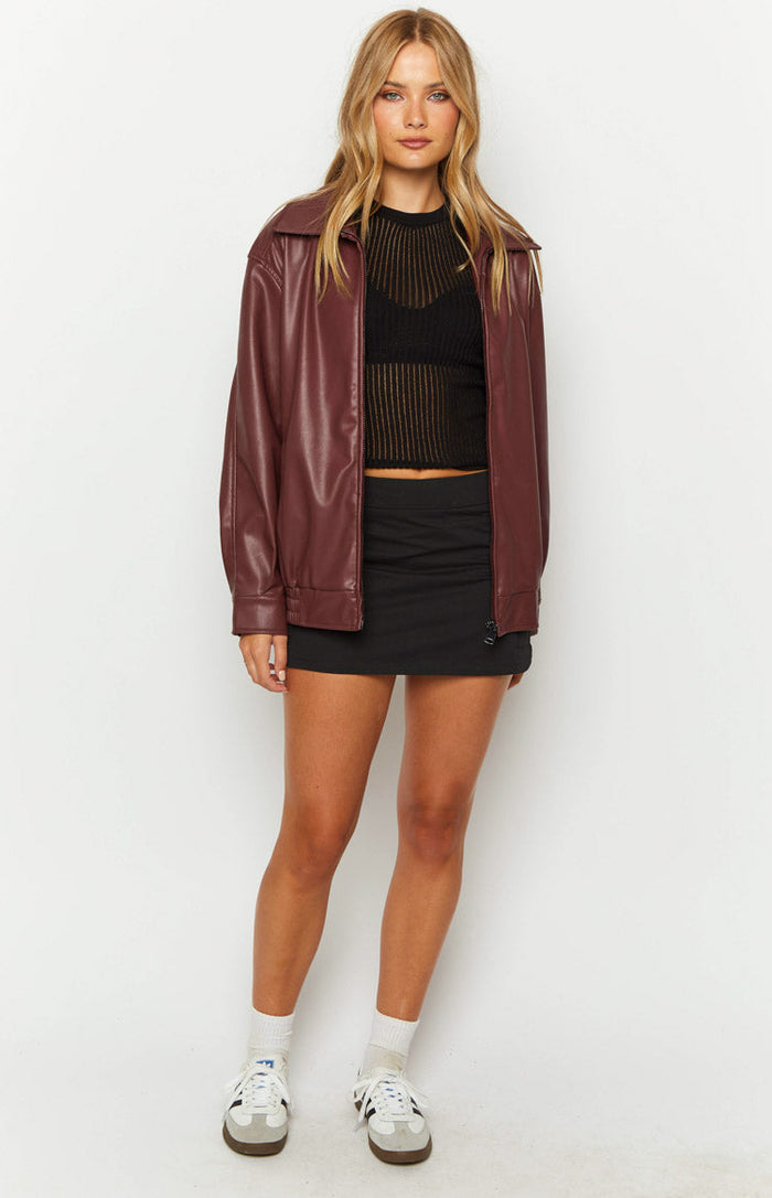 Front view of a red PU bomber jacket with a relaxed fit and open zipper front