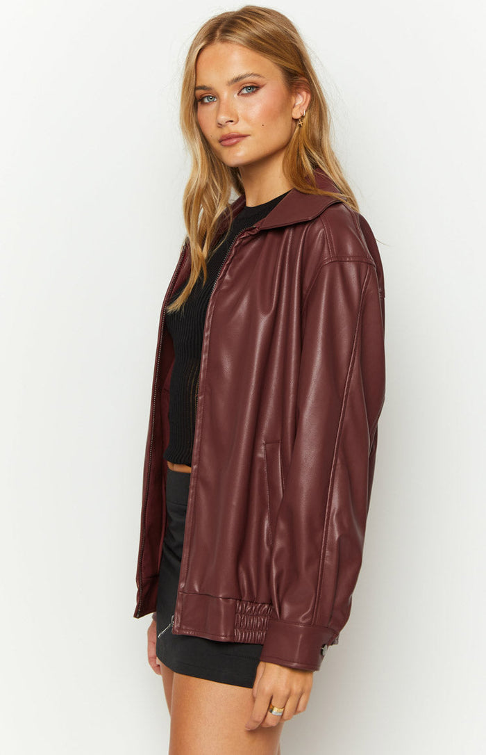 Side view of a red PU bomber jacket with an open zipper, relaxed fit, and elasticated hem and cuffs
