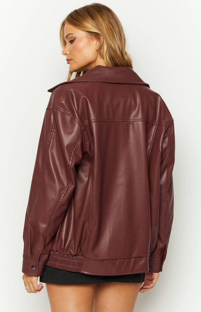 Rear-side view of a burgundy red PU bomber jacket with a ribbed hem and back yoke detail