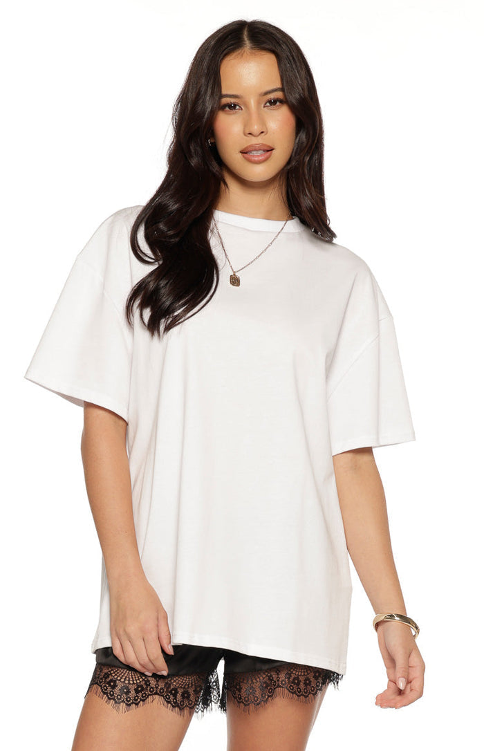 Front view of a white oversized tee with a classic crew neck and wide short sleeves