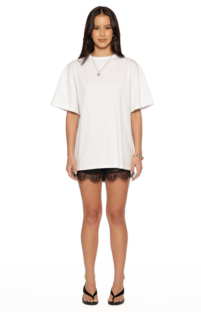 Oversized white short sleeve t-shirt with a relaxed fit and crew neckline