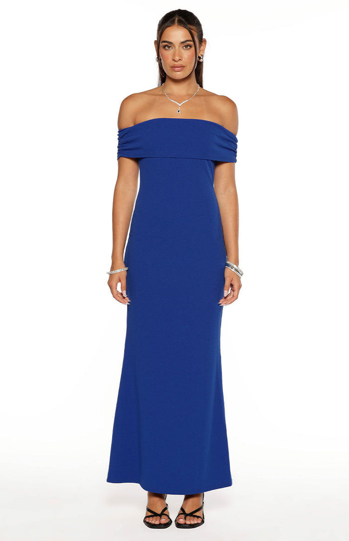 Cobalt blue crepe maxi dress with an off-shoulder folded neckline and a fitted silhouette