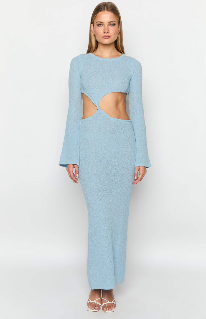 Front view of a light blue knit maxi dress with cutout waist and twisted knot detail, round neck, and long flared sleeves