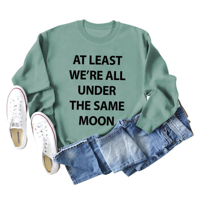 Light green sweater (black font) / S
