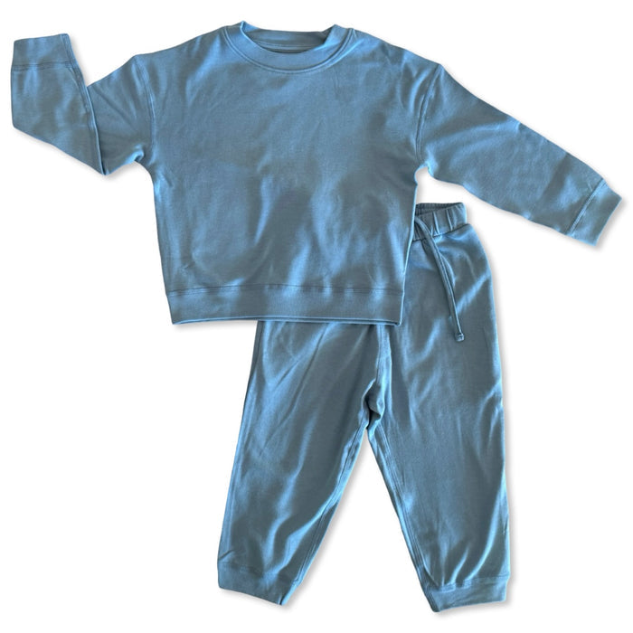 Blue children's sweatshirt and pants set on a white background