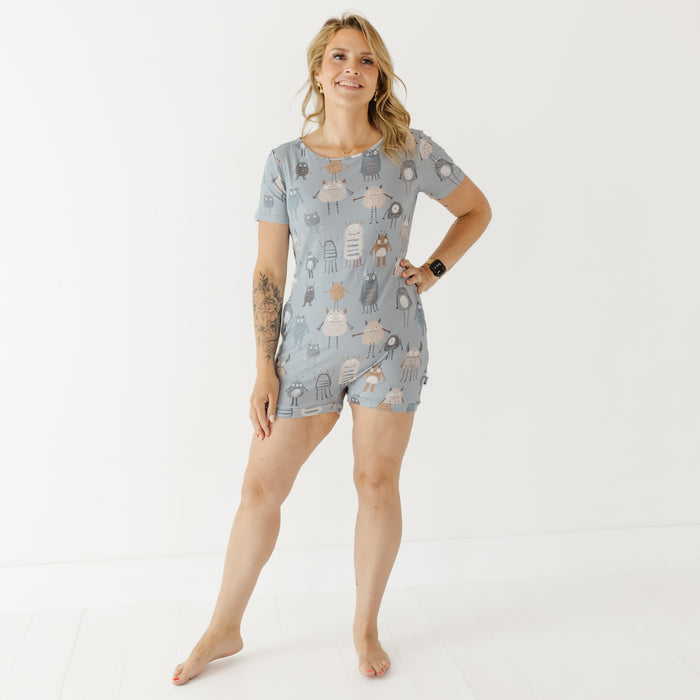 Woman wearing a patterned pajama set on a white background
