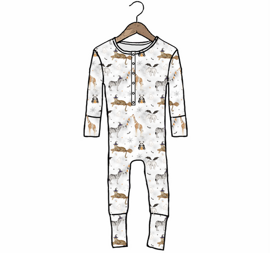 A long-sleeve baby jumpsuit with an allover safari animal print, hanging on a wooden hanger against a plain white background.