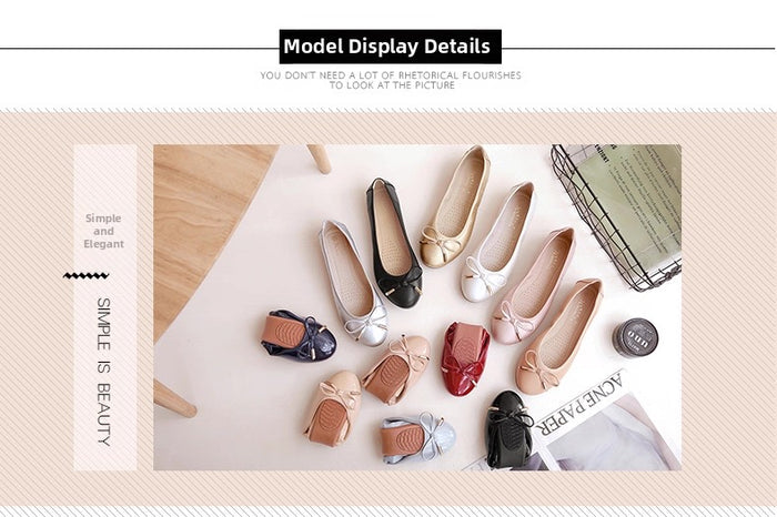 Collection of women's flats on a light surface with minimal background