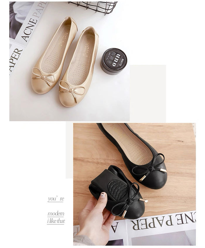 Beige and black flat shoes with bow details on a newspaper background