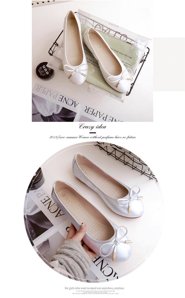 White shoes with bows on a magazine background