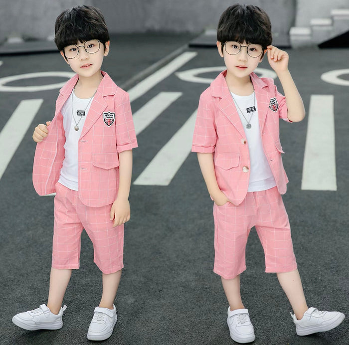 Two identical images of a child wearing a pink suit on a road.