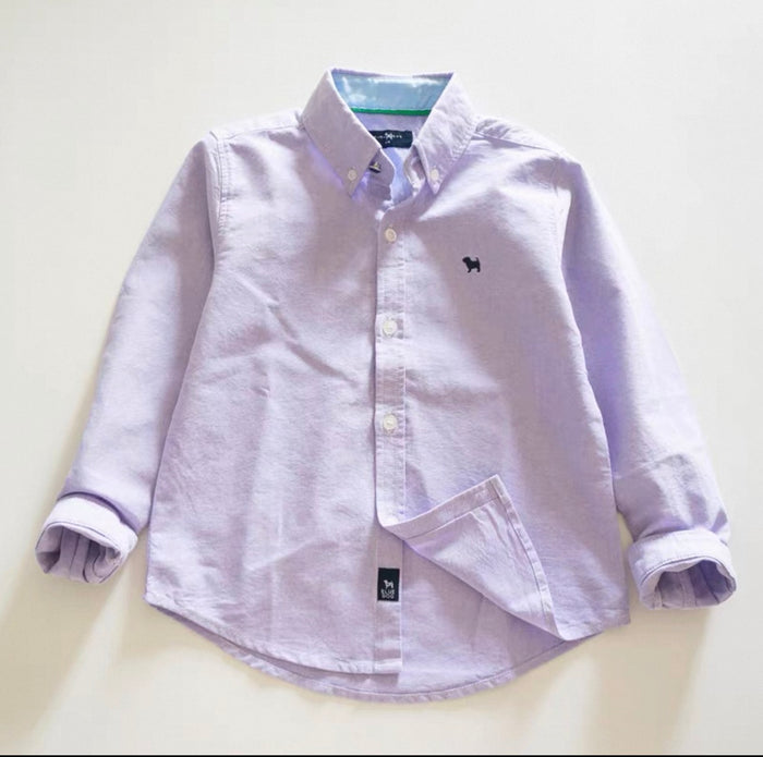Light purple button-up shirt with a small logo on a light beige background
