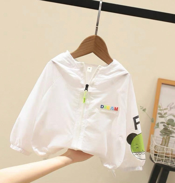 White children's jacket with colorful text and graphics on a hanger against a neutral background.