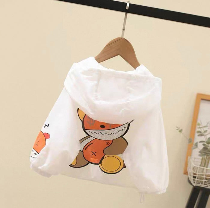 White baby raincoat with cartoon fox design on a hanger against a beige wall.