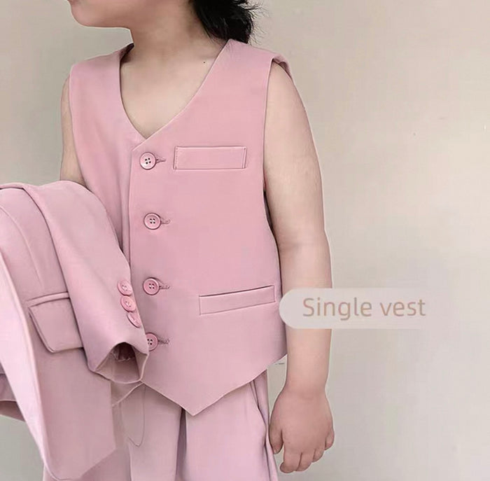 Person wearing a pink vest with a plain background