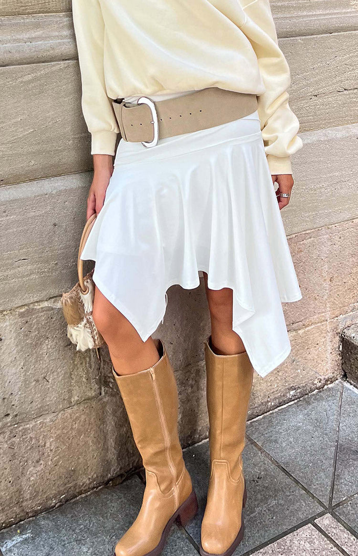 Beginning Boutique Brighton White Asymmetrical Midi Skirt white flowy asymmetrical midi skirt with a draped hem