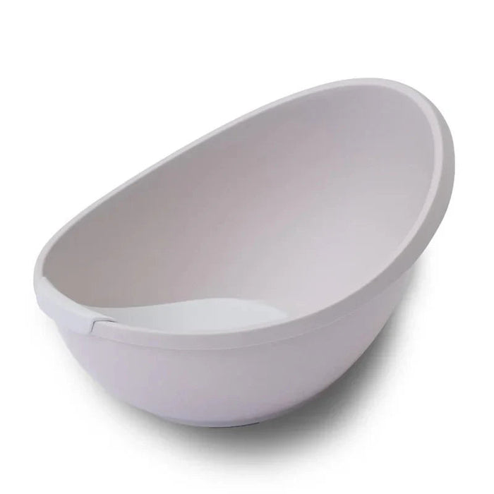 White plastic baby bathtub with bubble cuddle bath and Toshi Baby newborn support insert