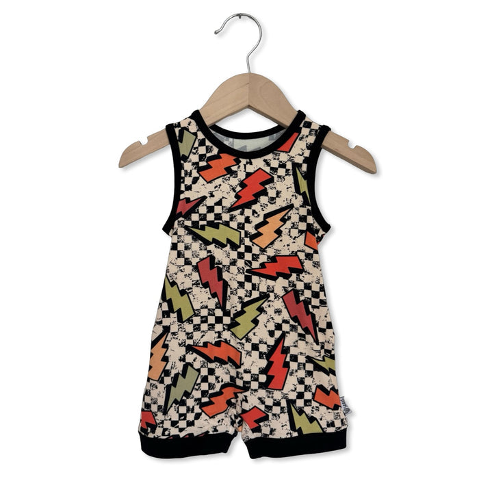 Children's romper with lightning bolt pattern on a hanger against a white background