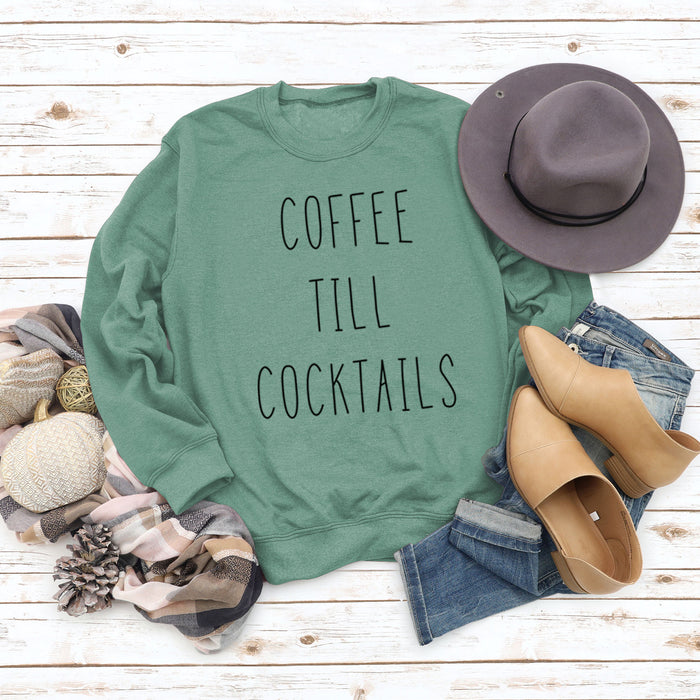 Light green sweater (black font) / S
