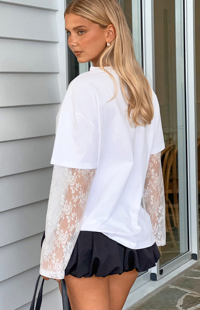 Side view of black bubble hem shorts with a gathered voluminous hem