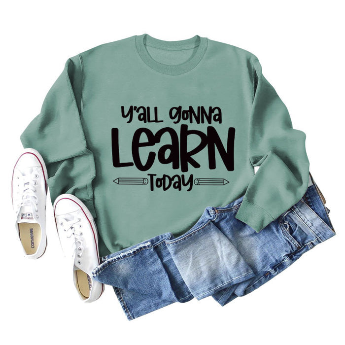 Light green sweater (black font) / S
