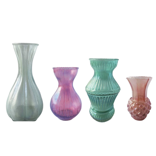 Four glass vases of different designs and colors on a white background