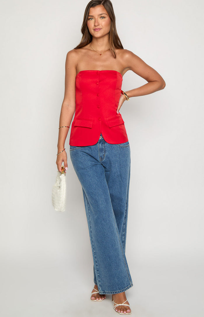 Red strapless top with a tailored fit, button-front closure, and two small flap pockets