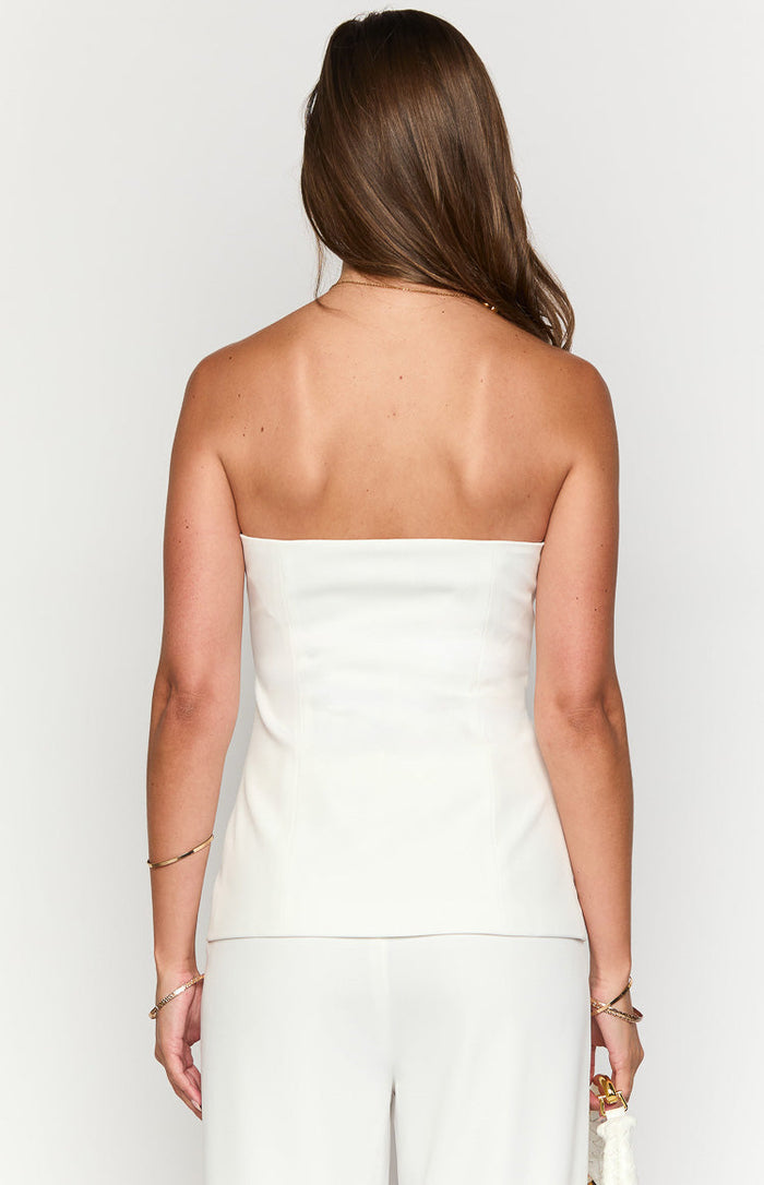 Rear view of a white strapless top showing the straight back neckline and vertical shaping seams
