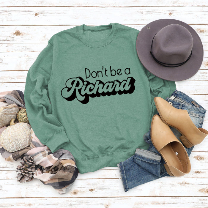 Light green sweater (black font) / S