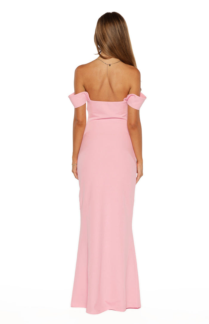 Rear view of a pink crepe off-shoulder maxi dress with short folded sleeves and a plain back