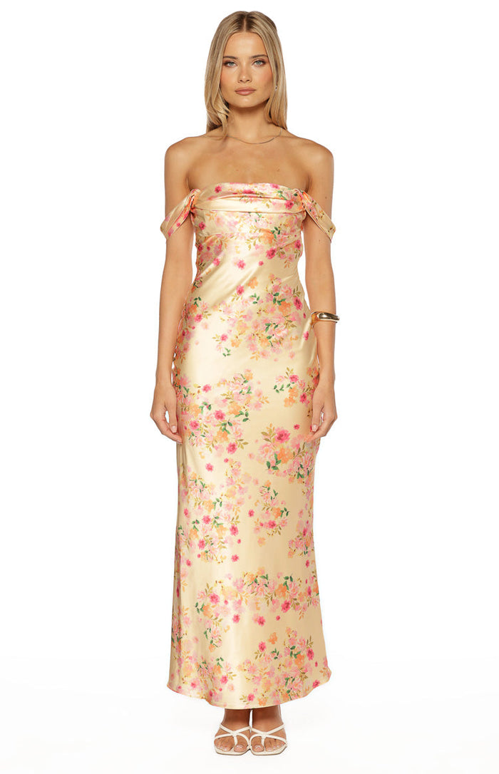 Yellow satin maxi dress with an off-shoulder cowl neckline, draped short sleeves, and pink floral print