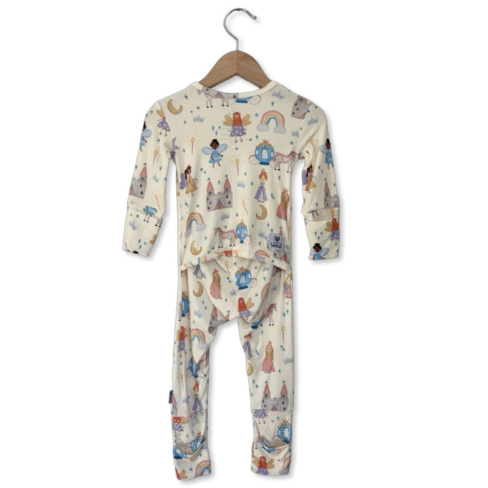 Children's pajama set with a pattern of cartoon characters on a hanger against a white background.