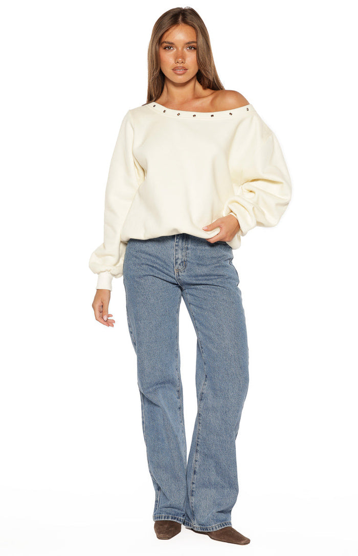 Full length view of mid wash blue denim jeans with a relaxed straight leg and front pockets
