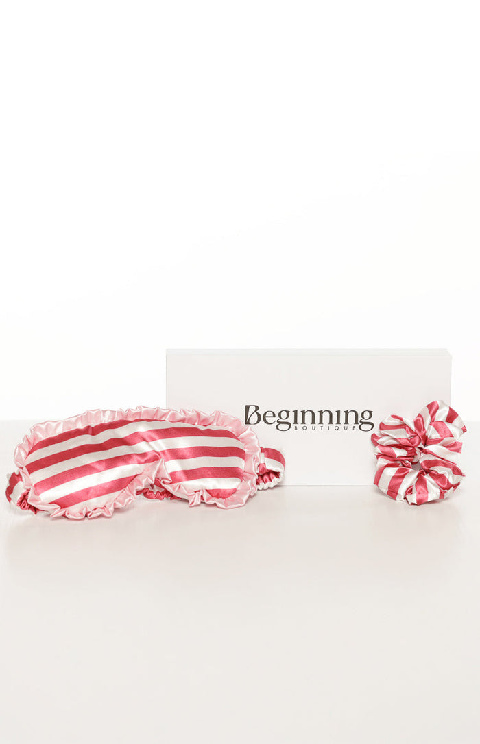 Pink and white striped satin eye mask with ruffled trim and a matching scrunchie