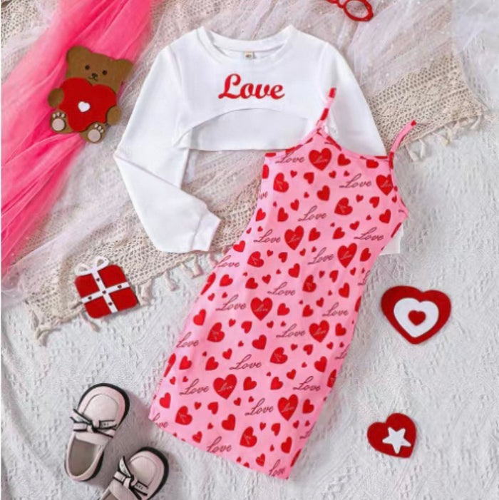 Children's outfit with 'Love' text on a white background, surrounded by heart-themed accessories.