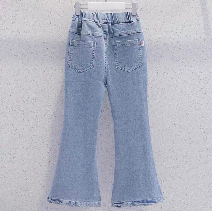 Light blue flared jeans on a white hanger against a light gray background
