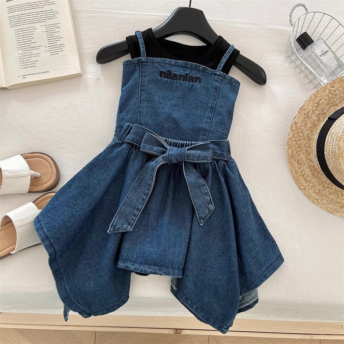 Blue denim dress with a belt on a hanger against a neutral background