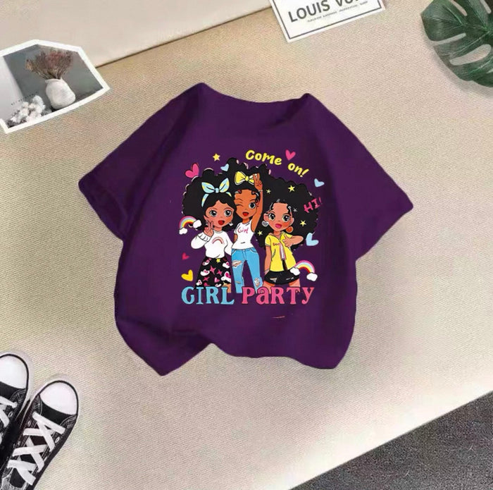Purple sweatshirt with cartoon characters and text on a beige surface