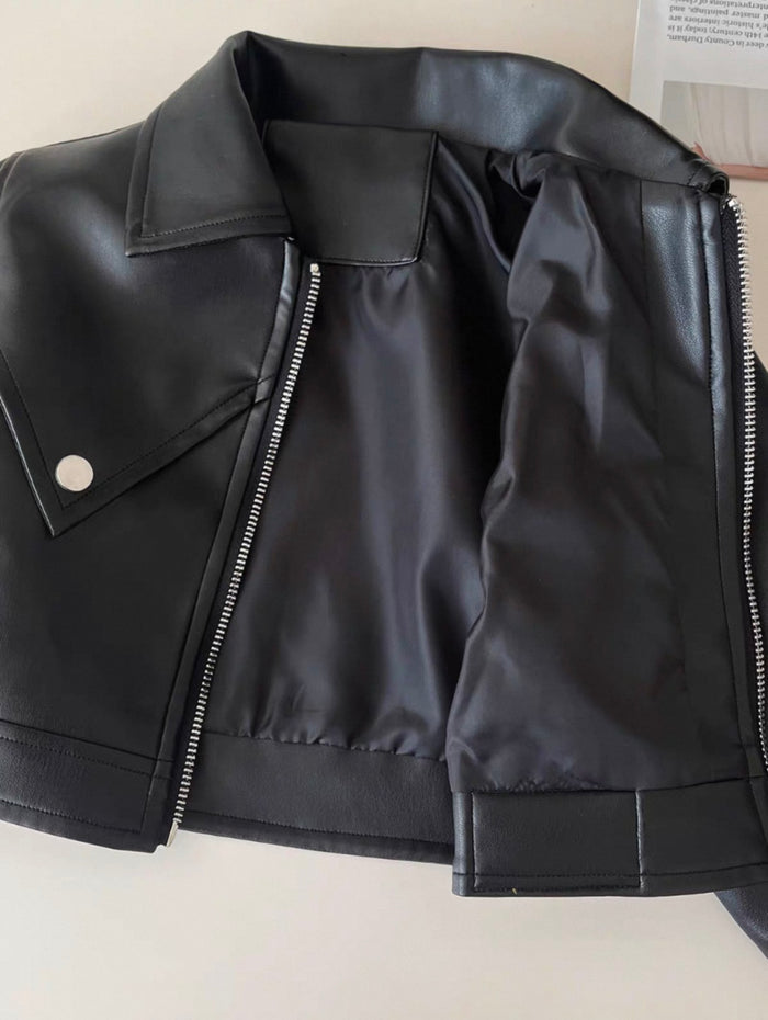 Black leather jacket with a zipper on a light background