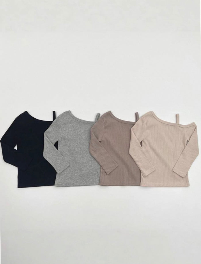 Four long-sleeve shirts in black, gray, brown, and beige on a white background