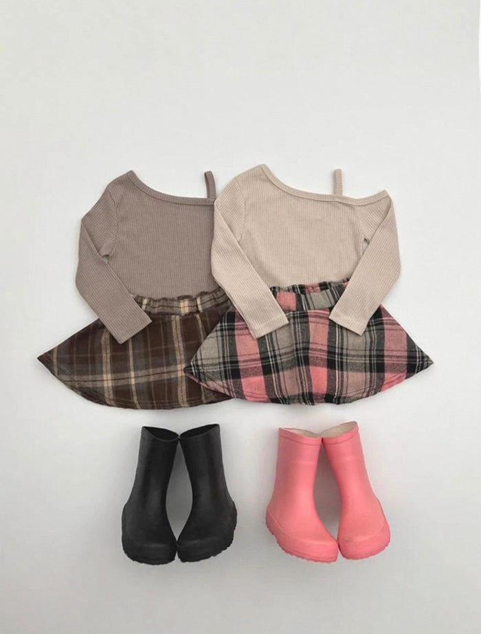 Two outfits with plaid skirts and different colored boots on a white background