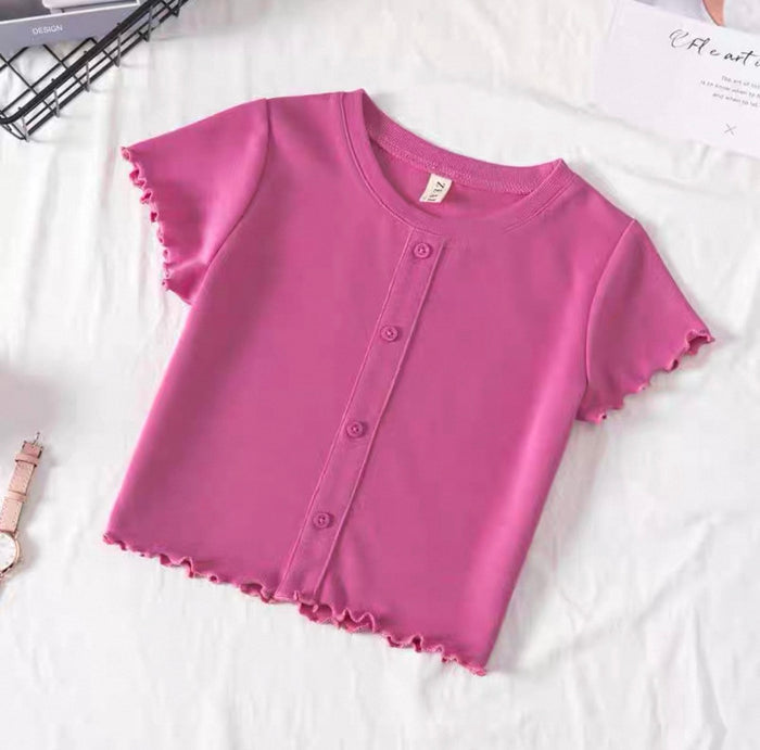 Purple shirt with ruffled edges on a white background