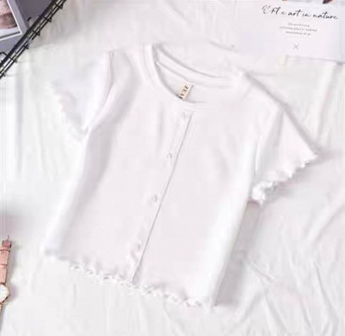 White blouse with ruffled details on a white background